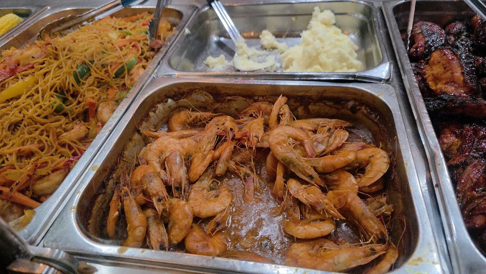 Jamaican plates with rice and seafood.
