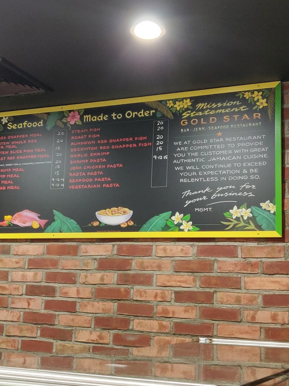 Printed menu featuring jerk and seafood items.